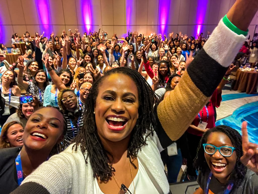 Brenda Darden Wilkerson posing for an energetic selfie with women and non-binary people at Grace Hopper Celebration
